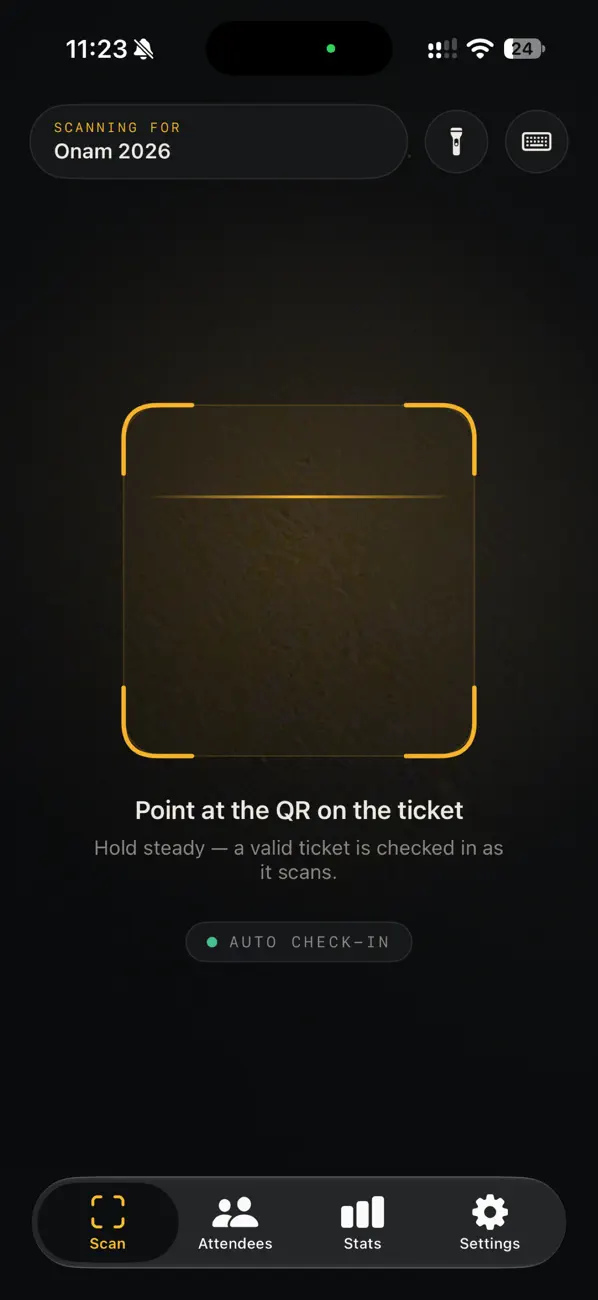 The scan screen: a viewfinder, “Point at the QR on the ticket”, and torch and manual-entry buttons.